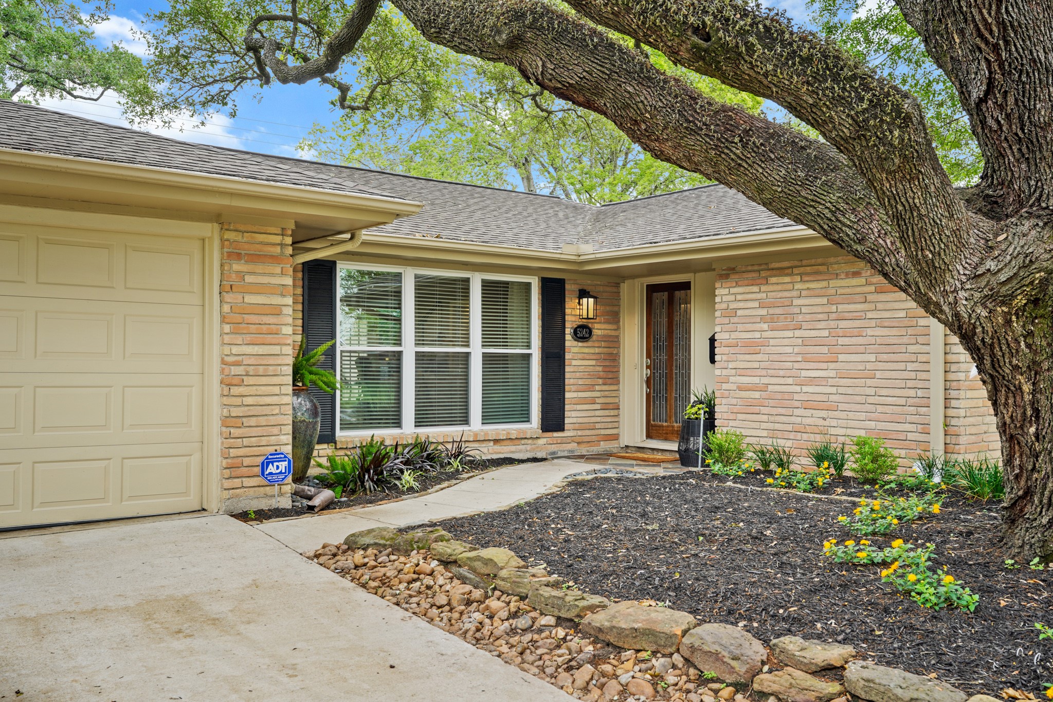 5242 Sanford Road Houston, TX 77035 - Photo 3 of 34 Another view of the beautiful front yard, landscaping and welcoming entrance.
