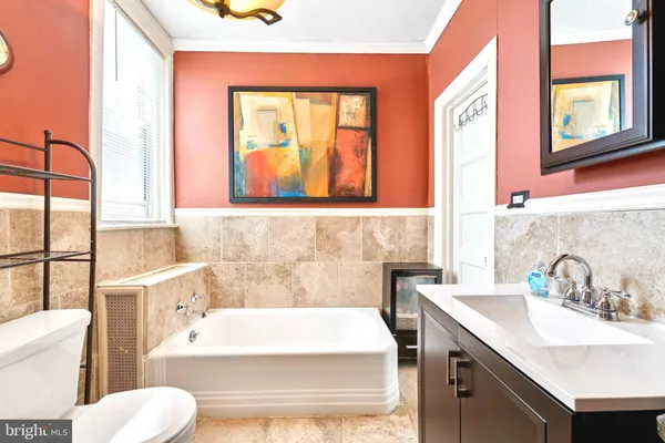 a bathroom with a sink and a bathtub