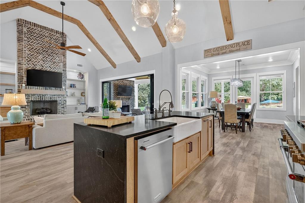 4621 Stanley Road Flowery Branch, GA 30542 - Photo 20 of 65 a kitchen with stainless steel appliances granite countertop a stove and cabinets