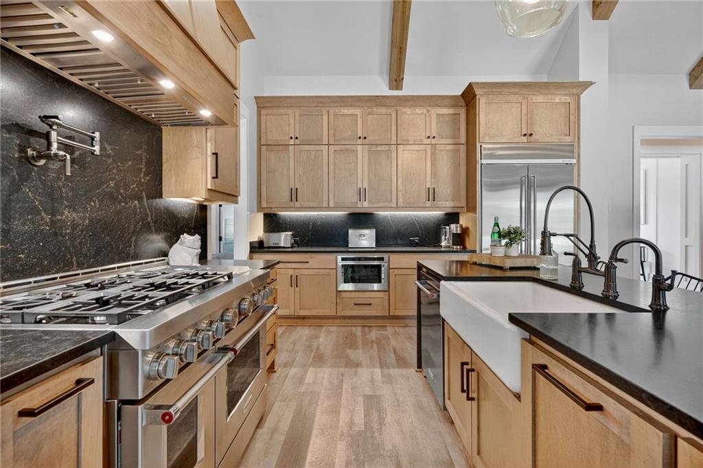 4621 Stanley Road Flowery Branch, GA 30542 - Photo 21 of 65 a kitchen with sink stove and cabinets