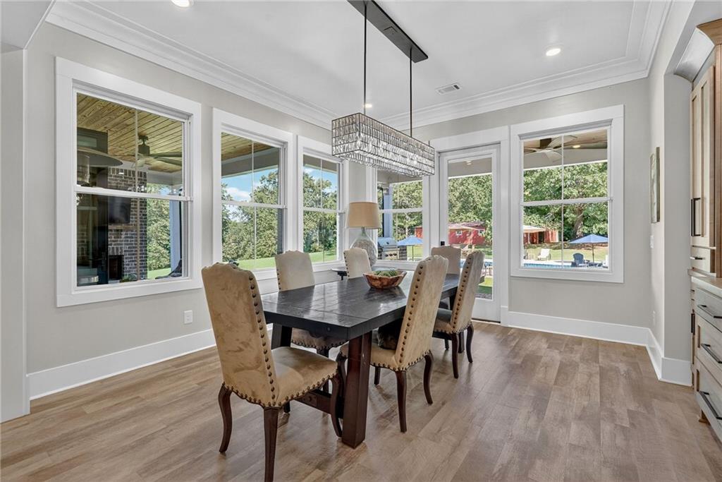 4621 Stanley Road Flowery Branch, GA 30542 - Photo 23 of 65 a view of a dining room with furniture window and outside view