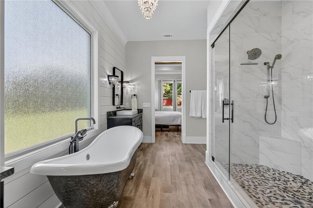 4621 Stanley Road Flowery Branch, GA 30542 - Photo 27 of 65 a bathroom with a sink and a mirror