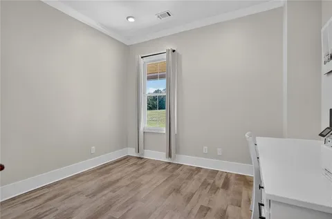a en suite bathroom with a double vanity sink and a mirror