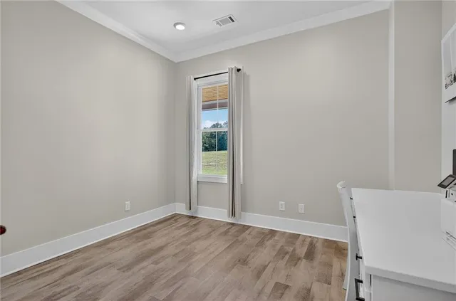 a en suite bathroom with a double vanity sink and a mirror