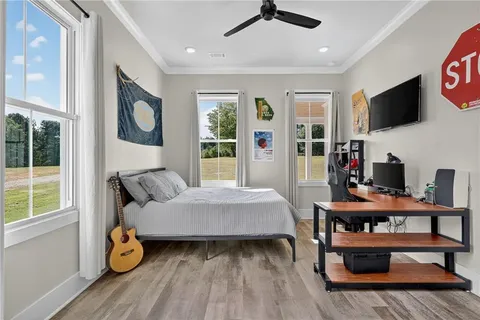 a view of workspace with wooden floor windows