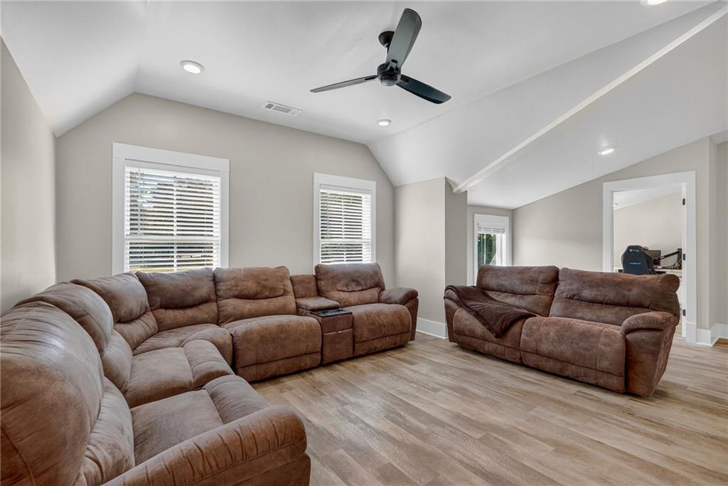 4621 Stanley Road Flowery Branch, GA 30542 - Photo 34 of 65 a living room with furniture and a window