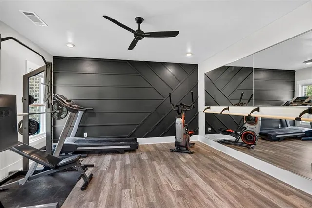 a view of a house with swimming pool and a yard