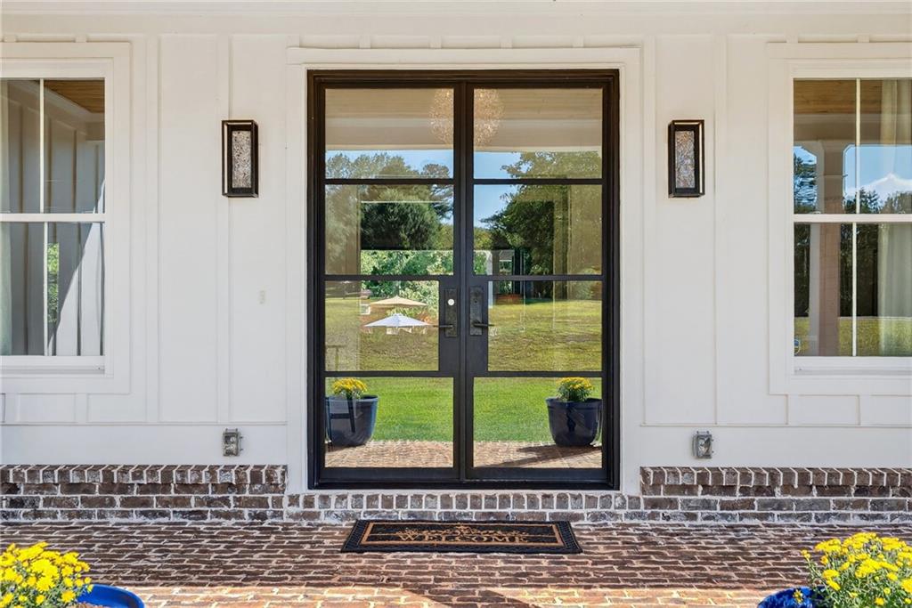 4621 Stanley Road Flowery Branch, GA 30542 - Photo 6 of 65 a view of a door front of house