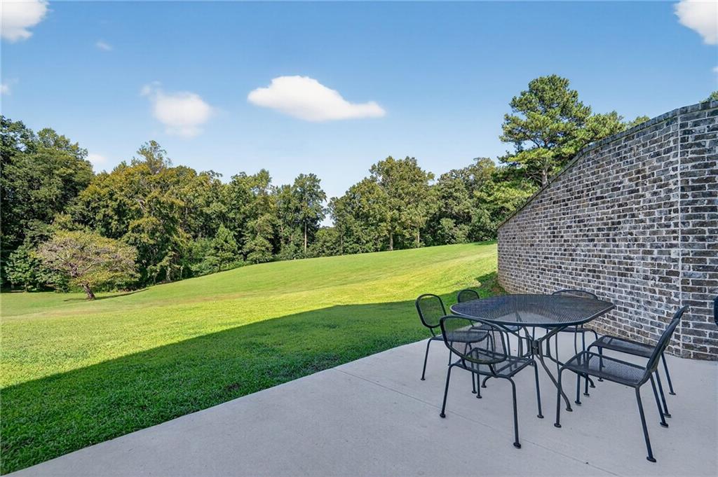 4621 Stanley Road Flowery Branch, GA 30542 - Photo 62 of 65 a view of a chairs and table on the garden