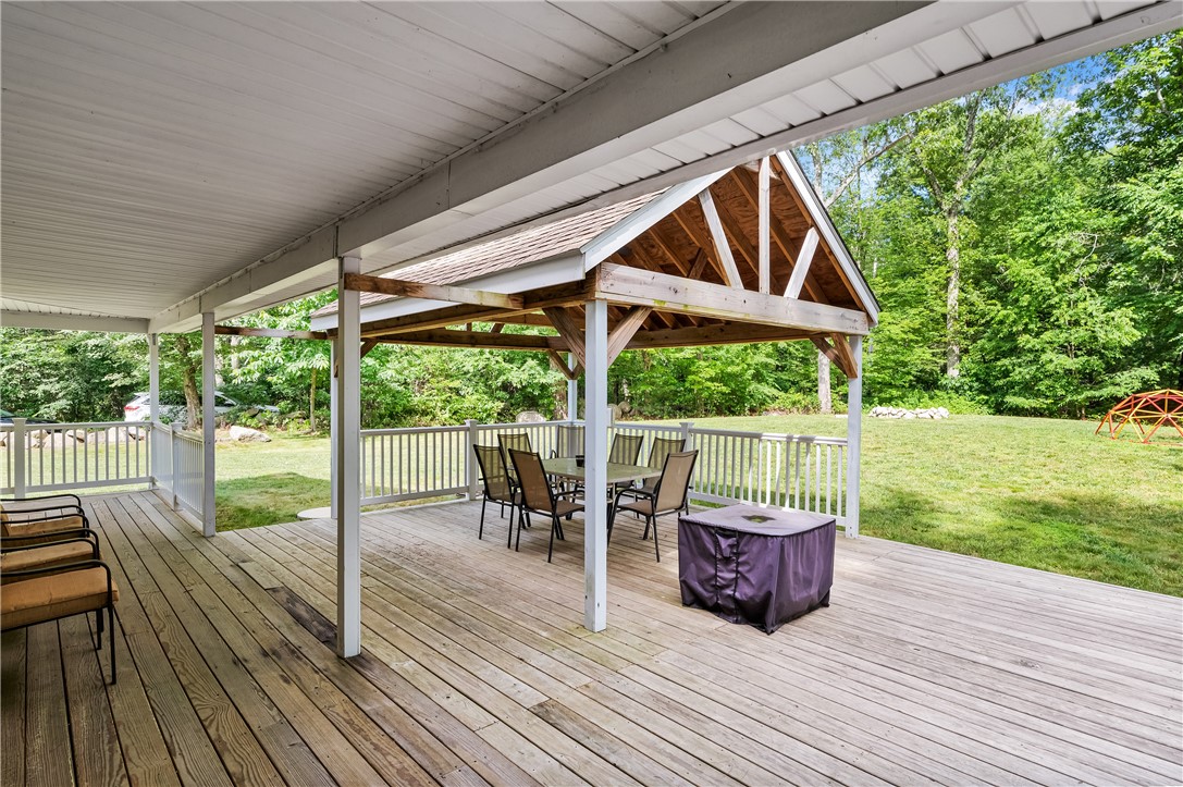 516 Durfee Hill Road Glocester, RI 02814 - Photo 31 of 41 516 Durfee Hill Rd - Covered Deck Left Side Of House Angle 3