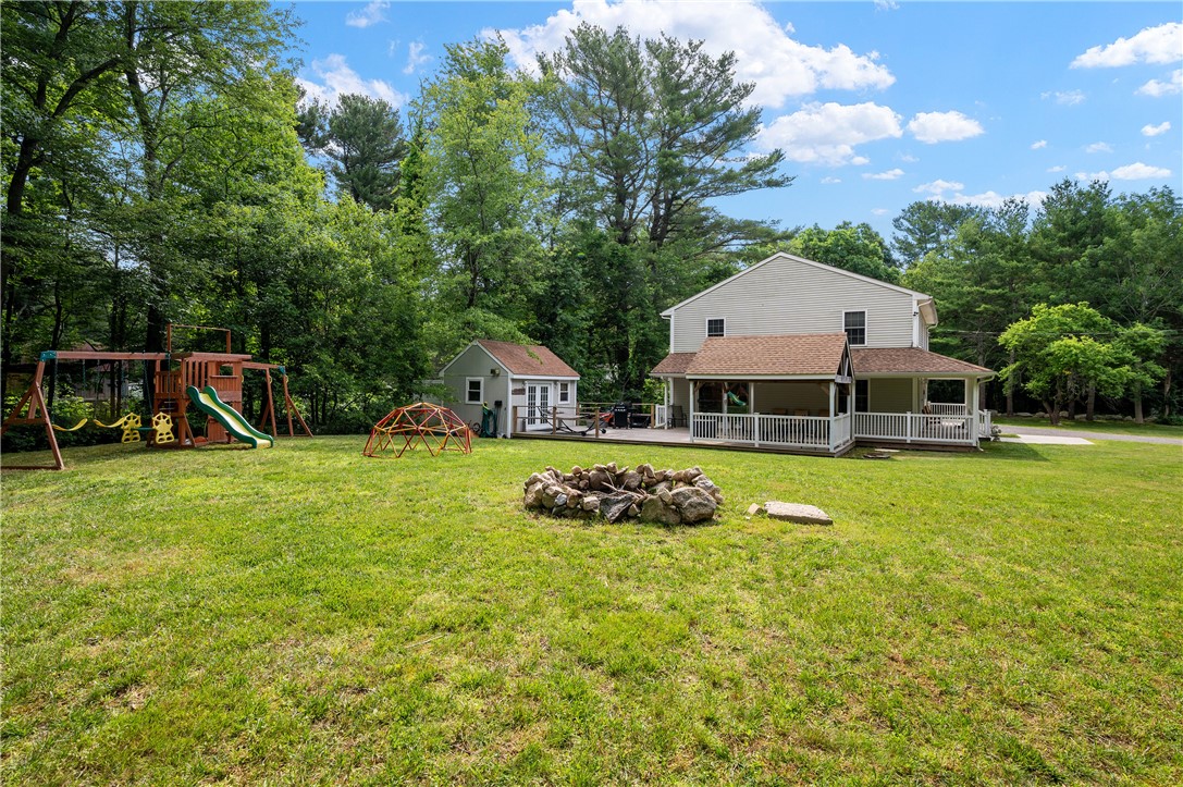 516 Durfee Hill Road Glocester, RI 02814 - Photo 34 of 41 516 Durfee Hill Rd - Left Side Of House with Fire Pit