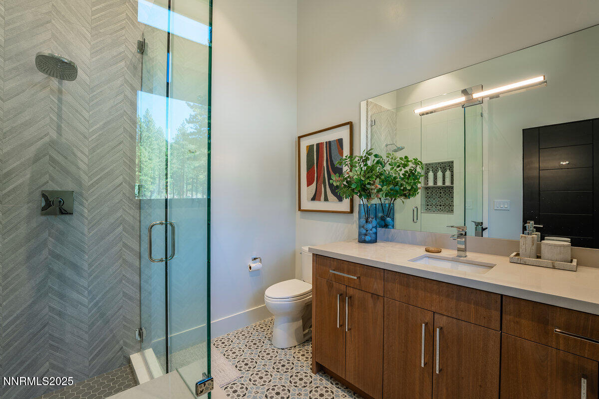 181 Redding Way Carson City, NV 89705 - Photo 28 of 40 a bathroom with a sink a toilet and shower