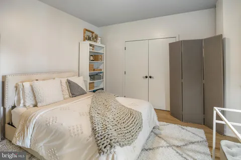 a bed room with a bed and furniture