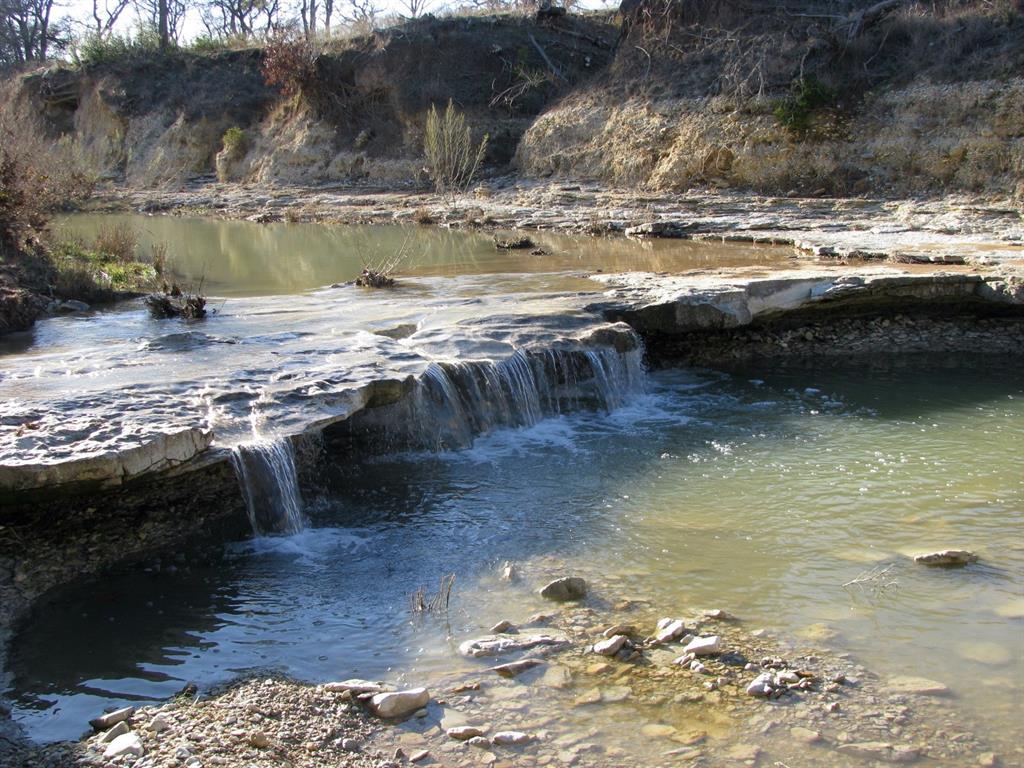 675 Fossil Rdg Court Evant, TX 76525 - Photo 4 of 26 a view of a water pond