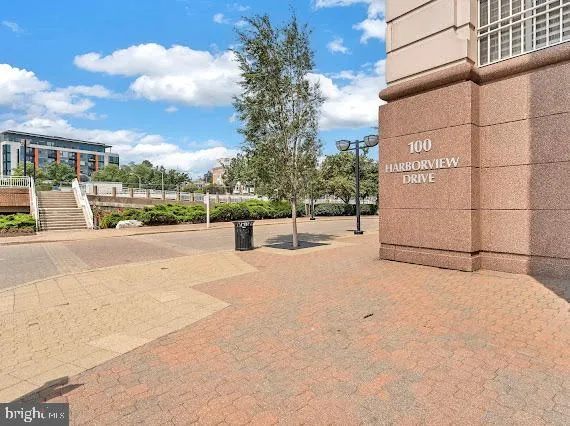 a view of a street with a building in the background