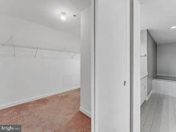 a view of hallway with closet