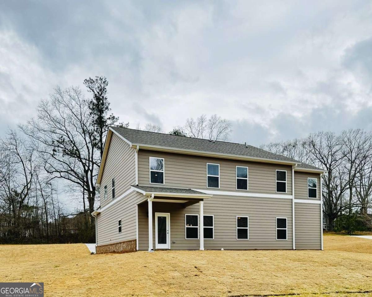 59 Observation Court, Unit 129 Dallas, GA 30132 - Photo 19 of 22 a front view of house with yard