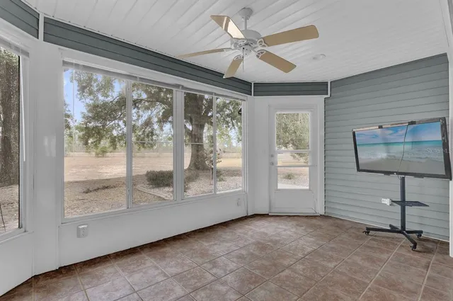 a view of an entryway with a floor to ceiling window