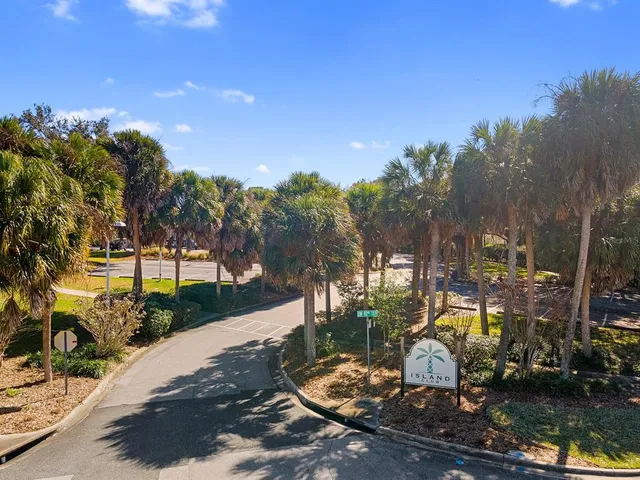 an aerial view of a house with garden space and swimming pool