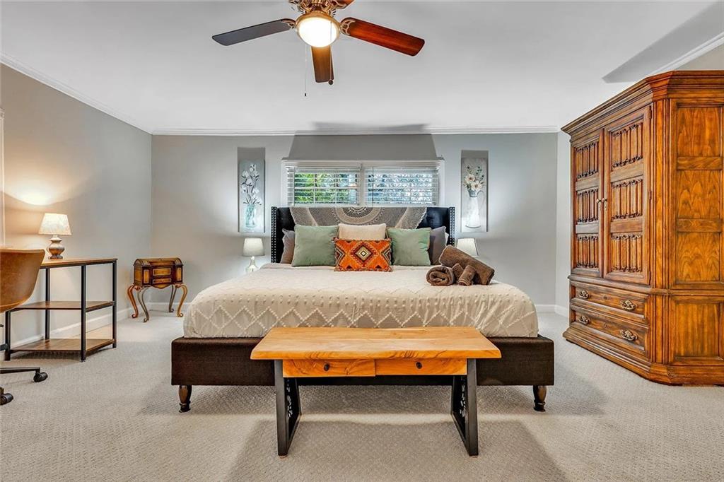 72 Kenyon Street Southeast, Unit 72 Atlanta, GA 30316 - Photo 9 of 10 a bedroom with a bed and a chandelier