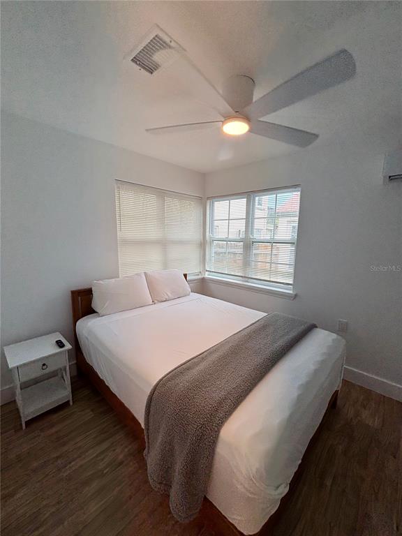 14141 Gulf Boulevard, Unit 5 Madeira Beach, FL 33708 - Photo 7 of 14 a bedroom with a bed and a window