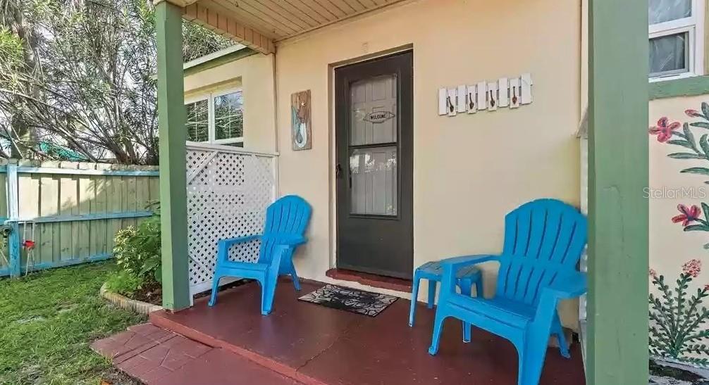 14141 Gulf Boulevard, Unit 5 Madeira Beach, FL 33708 - Photo 9 of 14 a view of a chairs in a patio