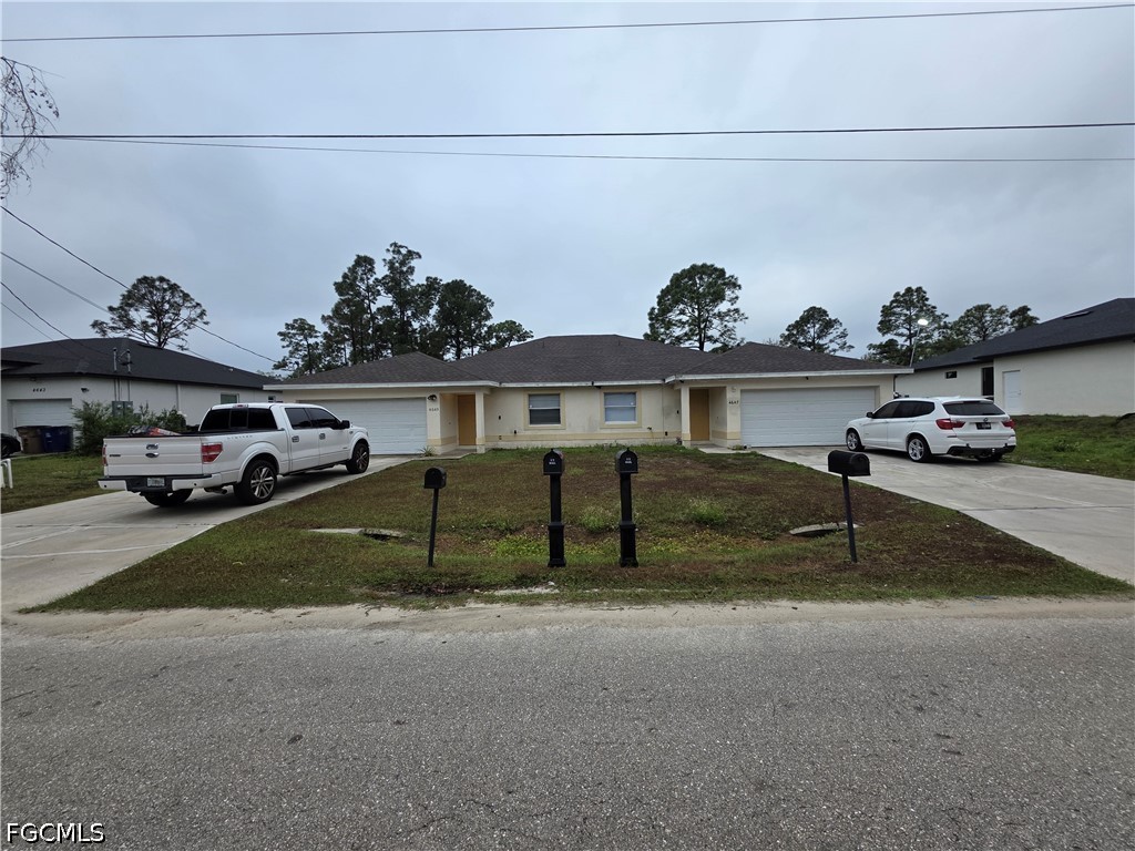 4647 24th Street Southwest Lehigh Acres, FL 33973 - Photo 1 of 12 a view of a car garage
