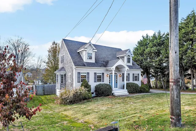 a front view of a house with a yard