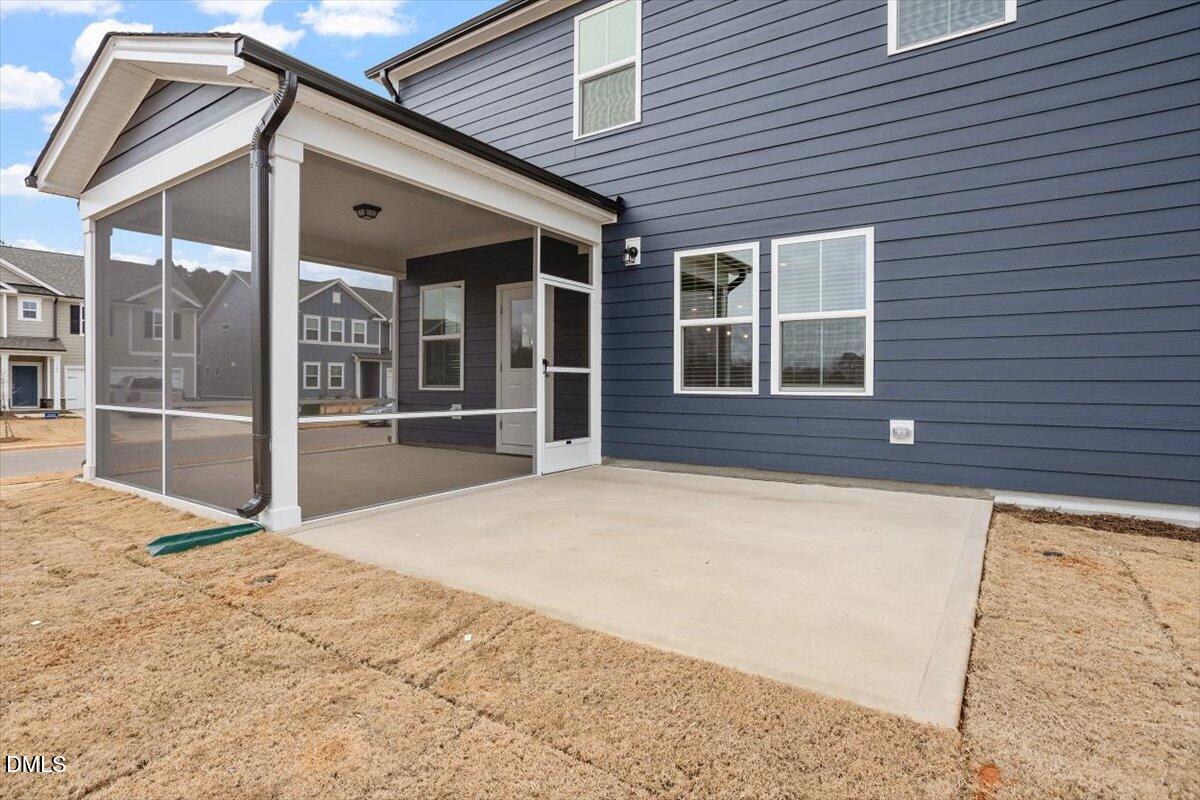 465 Grange Farm Place Raleigh, NC 27603 - Photo 12 of 44 a view of house with large windows