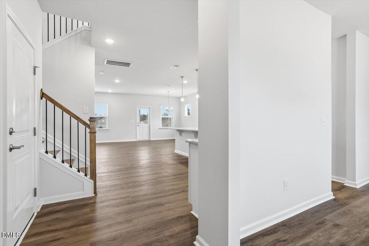 465 Grange Farm Place Raleigh, NC 27603 - Photo 14 of 44 a view of an entryway with wooden floor