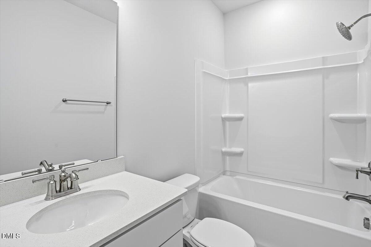 465 Grange Farm Place Raleigh, NC 27603 - Photo 31 of 44 a bathroom with a sink toilet and shower