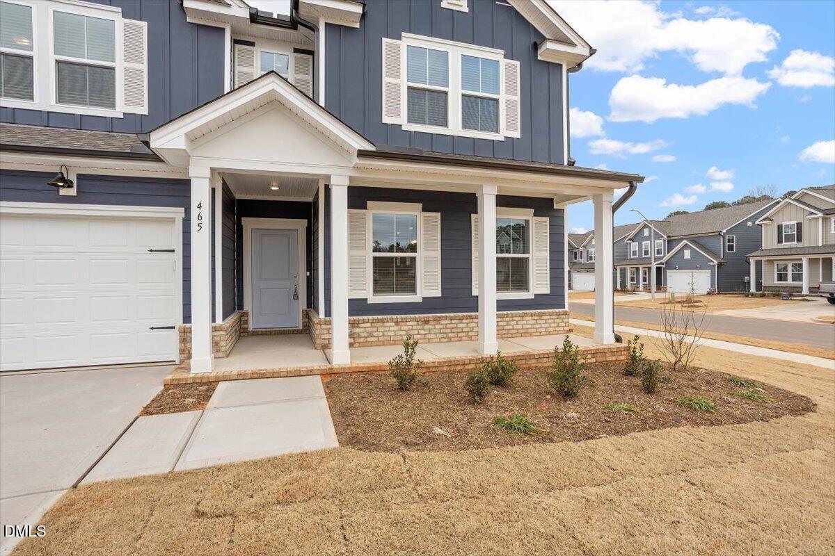 465 Grange Farm Place Raleigh, NC 27603 - Photo 7 of 44 a front view of a house with a yard