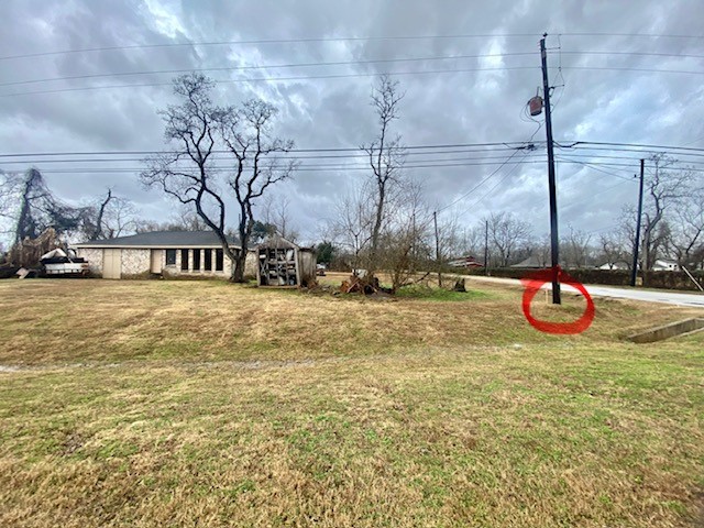 5204 Knight Road Rosharon, TX 77583 - Photo 11 of 12 The stake near the power line is the front right corner of the lot.