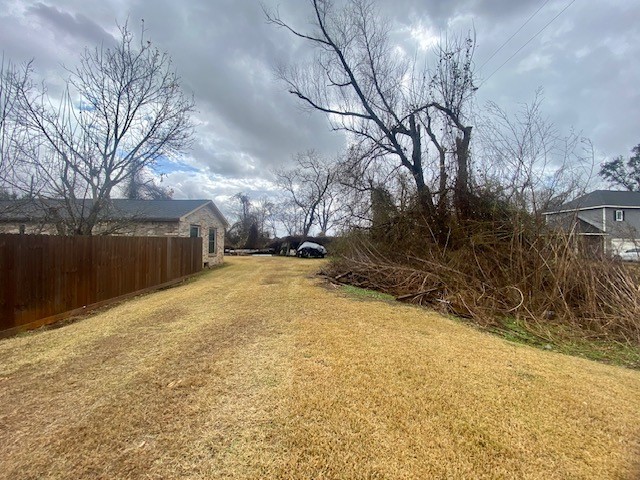 5204 Knight Road Rosharon, TX 77583 - Photo 9 of 12 View of the rear of the house with the brush line being the rear of the lot line.
