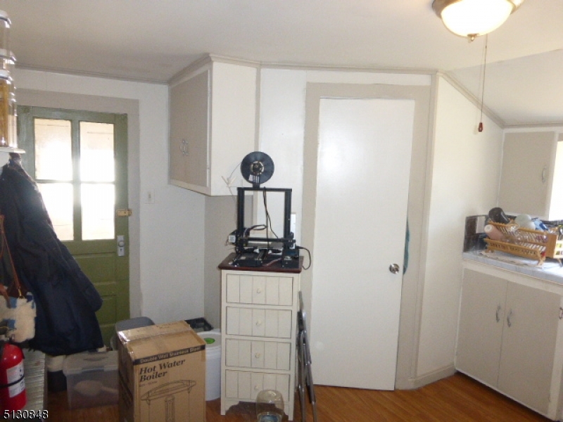 9 New Row Road, Unit A Hibernia, NJ 07842 - Photo 12 of 28 a view of room with cabinets and wooden floor
