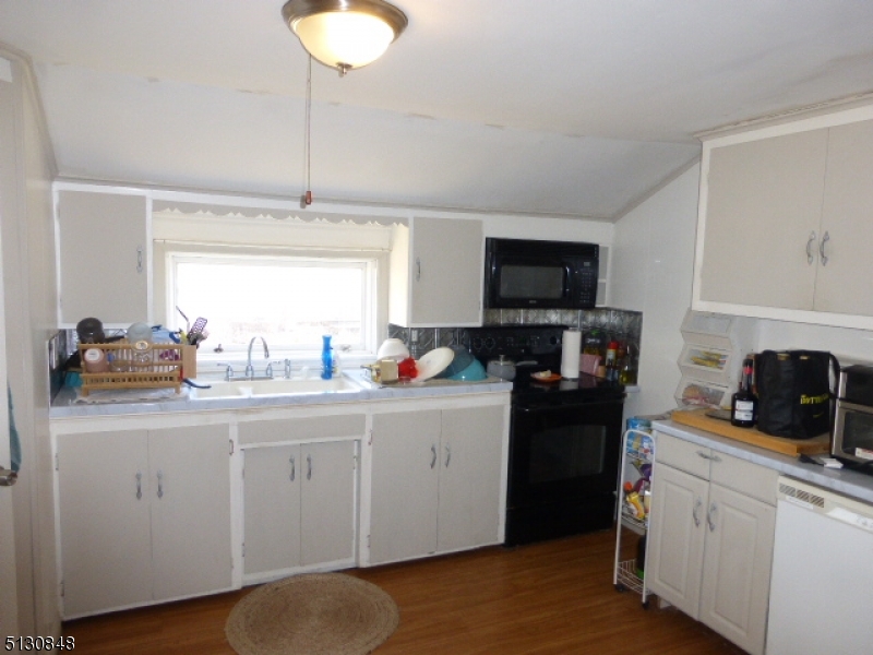 9 New Row Road, Unit A Hibernia, NJ 07842 - Photo 13 of 28 a kitchen with a sink cabinets and window