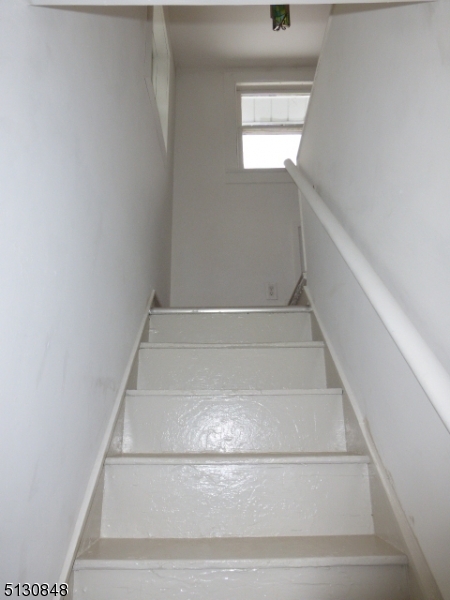 9 New Row Road, Unit A Hibernia, NJ 07842 - Photo 16 of 28 a view of staircase with a white walls and a window
