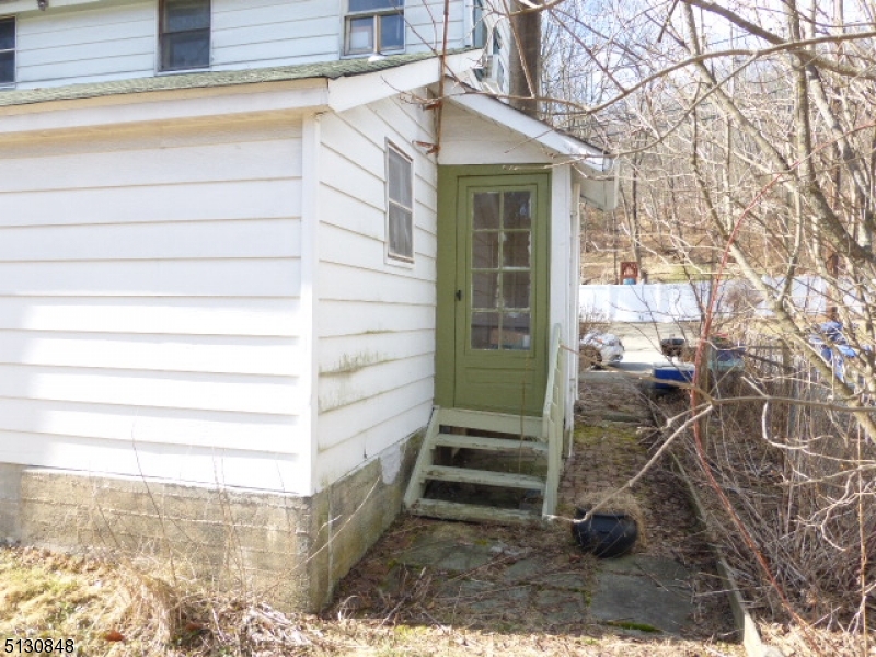 9 New Row Road, Unit A Hibernia, NJ 07842 - Photo 25 of 28 a view of a house with a backyard