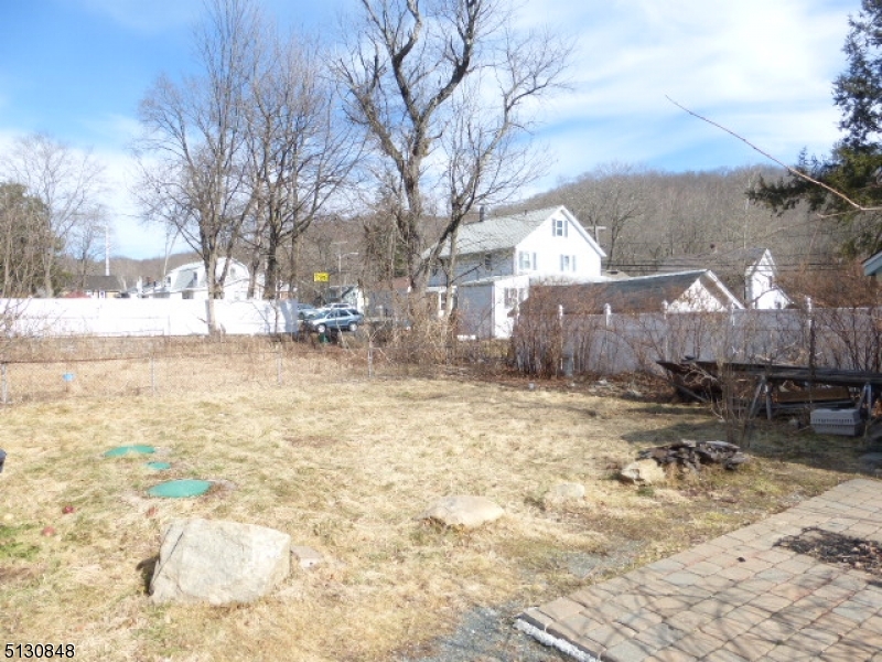9 New Row Road, Unit A Hibernia, NJ 07842 - Photo 28 of 28 a view of a yard with a large tree