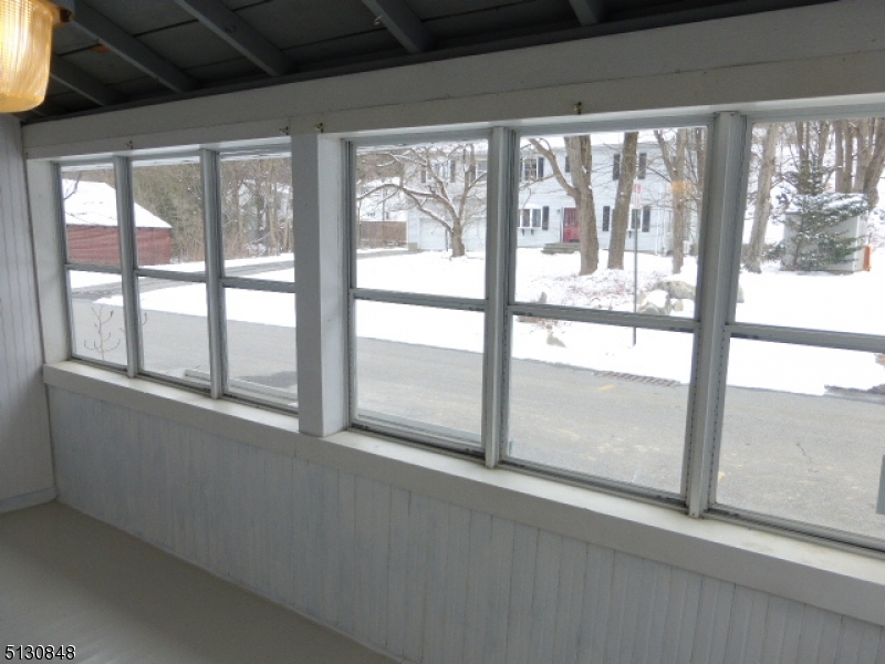 9 New Row Road, Unit A Hibernia, NJ 07842 - Photo 3 of 28 a view of an empty room with wooden floor and a window
