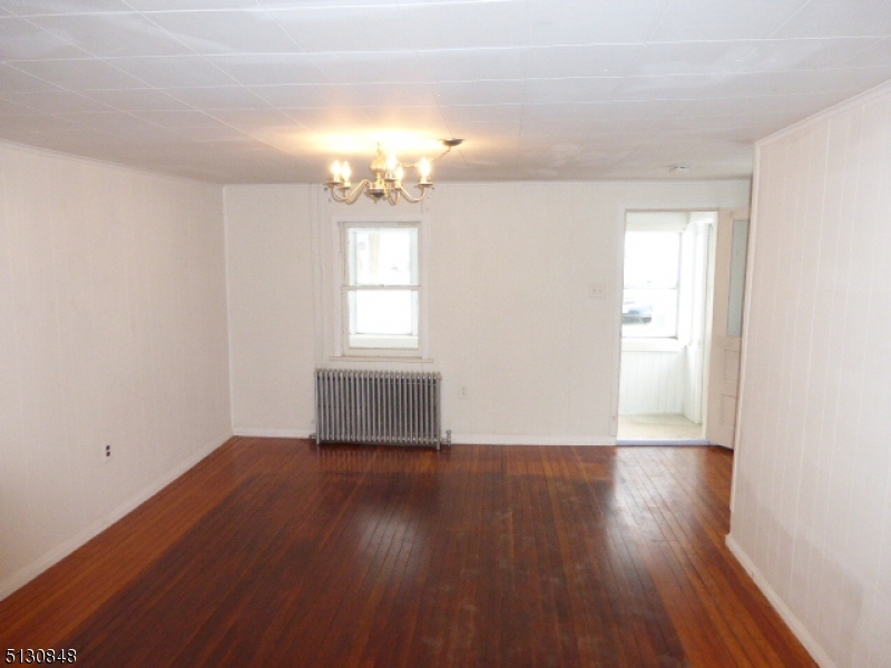 9 New Row Road, Unit A Hibernia, NJ 07842 - Photo 6 of 28 an empty room with wooden floor and windows