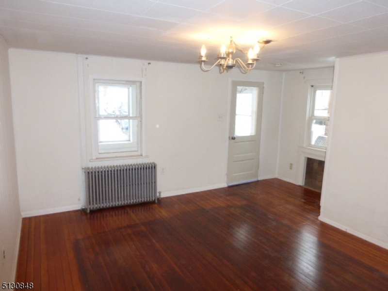 9 New Row Road, Unit A Hibernia, NJ 07842 - Photo 8 of 28 a view of empty room with wooden floor and fan