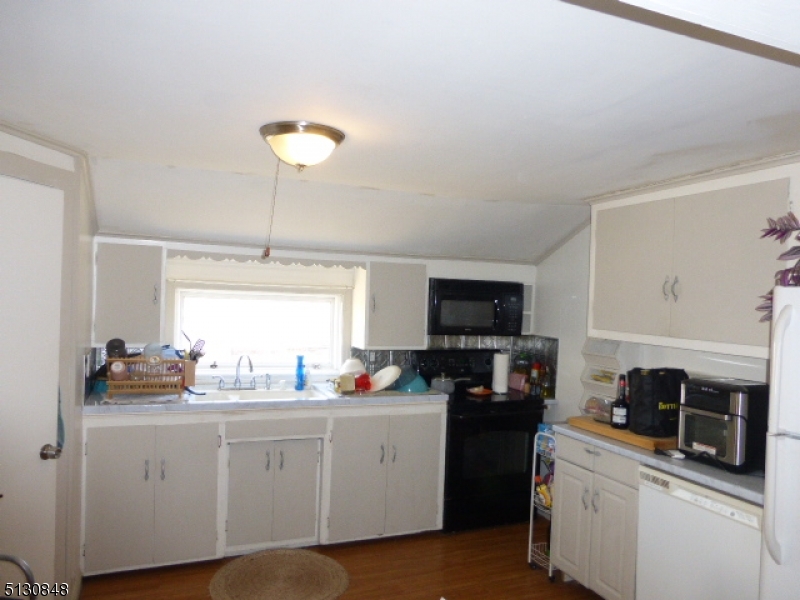 9 New Row Road, Unit A Hibernia, NJ 07842 - Photo 10 of 28 a kitchen with a sink cabinets and window