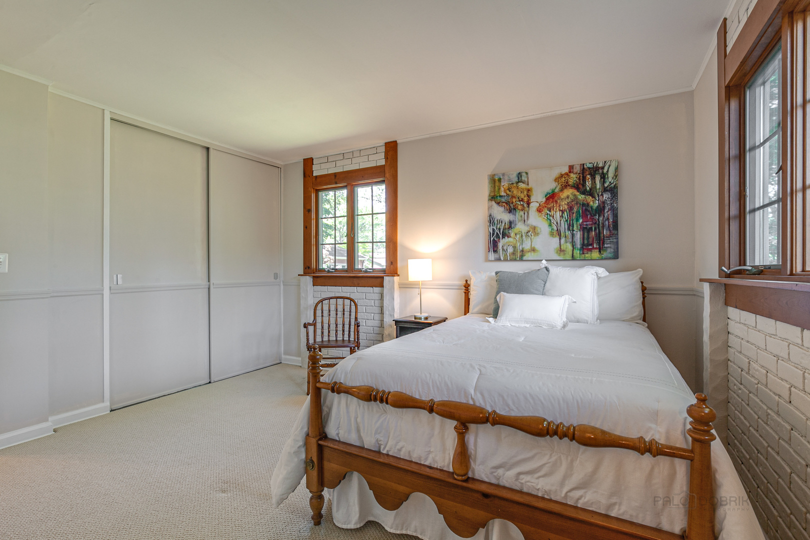 38 Golfview Road Lake Zurich, IL 60047 - Photo 17 of 27 a bedroom with a bed a painting on the wall and a window