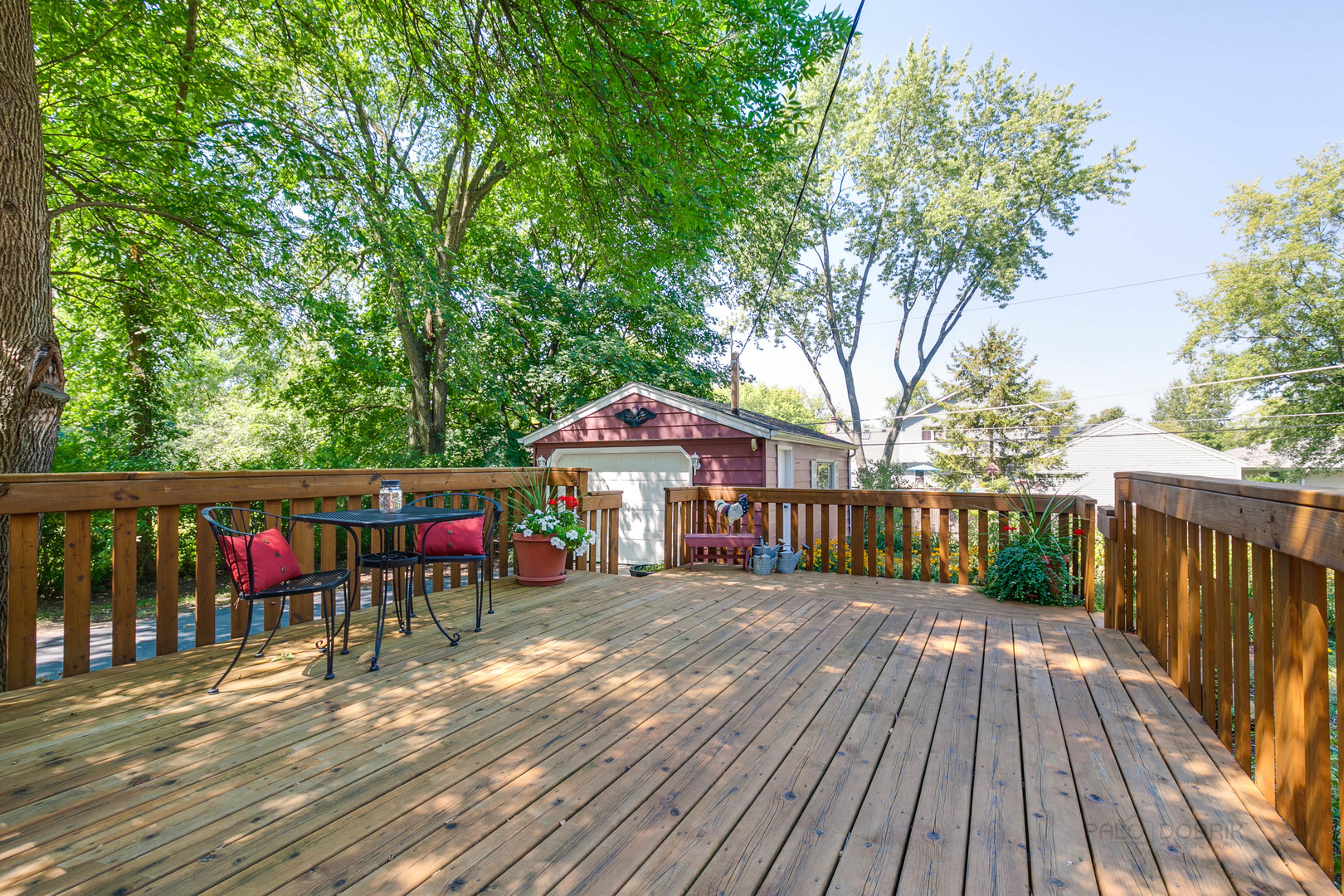 38 Golfview Road Lake Zurich, IL 60047 - Photo 23 of 27 a view of a wooden balcony and chairs