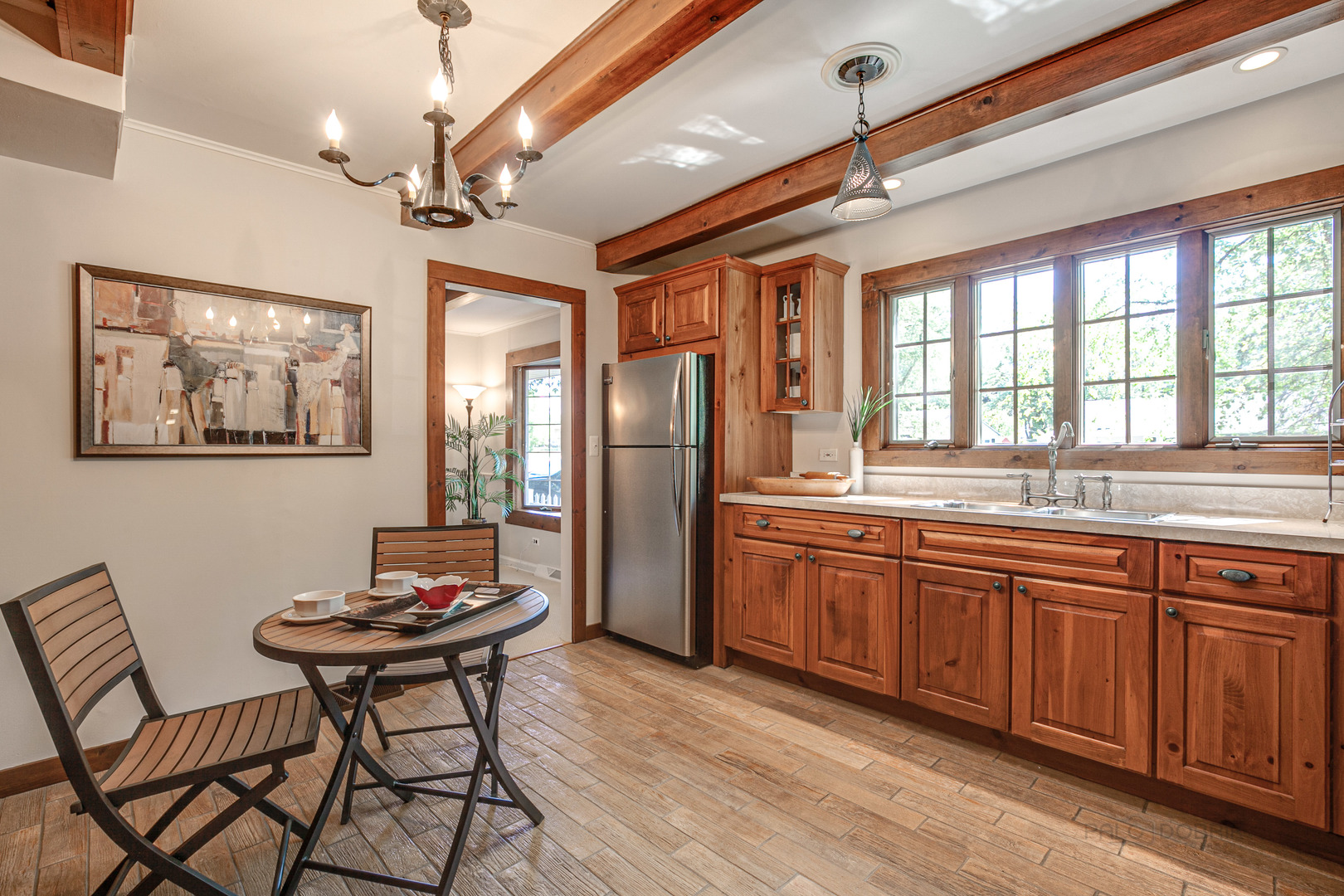 38 Golfview Road Lake Zurich, IL 60047 - Photo 9 of 27 a kitchen with stainless steel appliances granite countertop a dining table chairs and white cabinets
