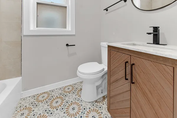 a bathroom with a toilet and a sink