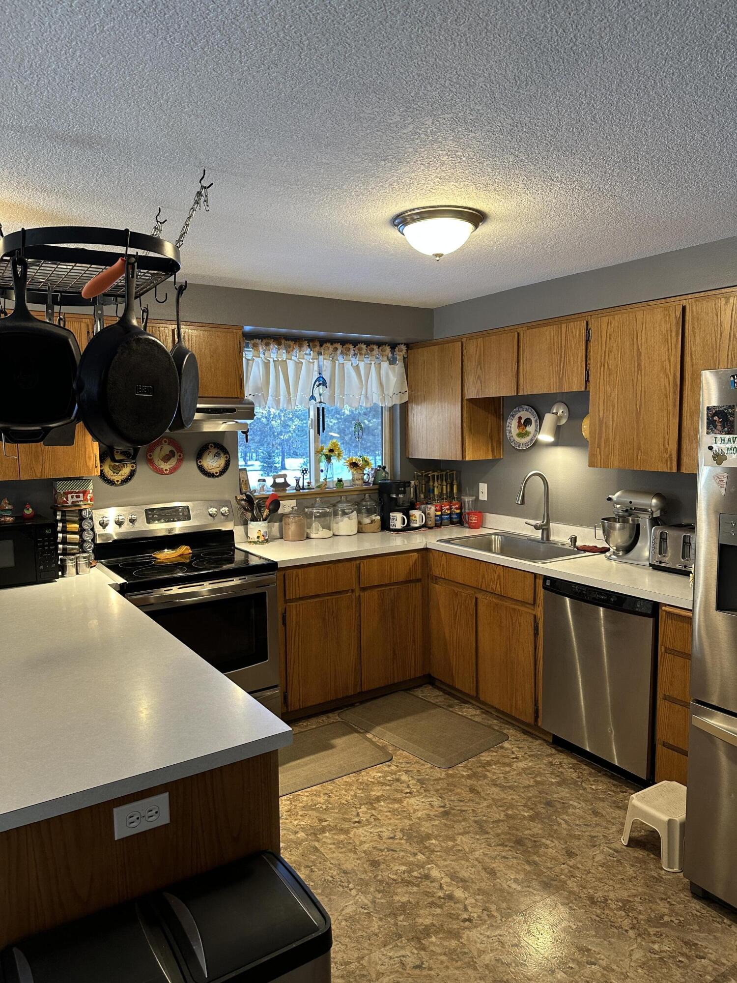 123977 Surveyor Road Crescent Lake, OR 97733 - Photo 20 of 41 a kitchen with a sink cabinets and window