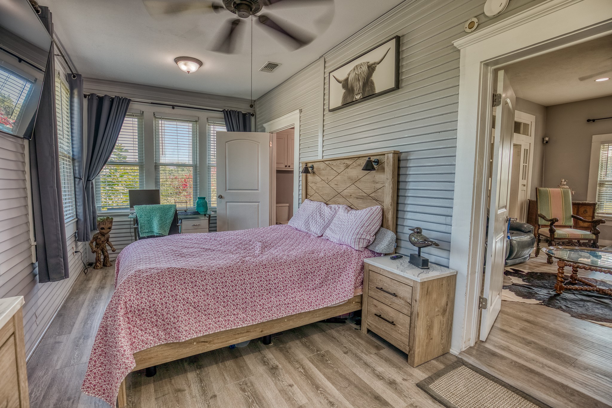 10347 Pless Road Cat Spring, TX 78933 - Photo 11 of 19 a bedroom with a bed and a chandelier