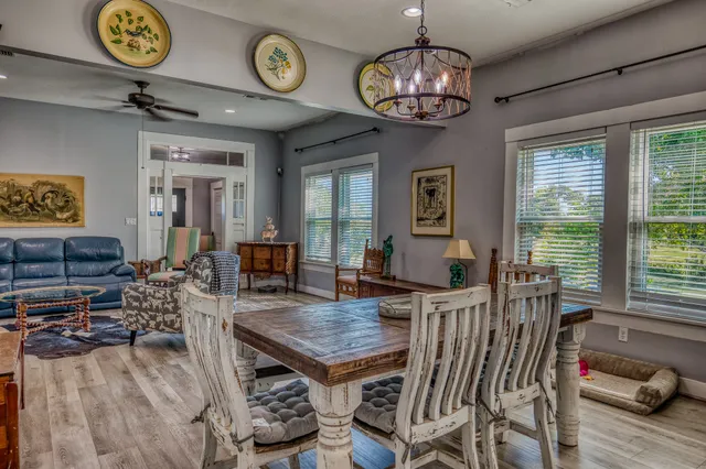 a view of a dining room with furniture window and wooden floor